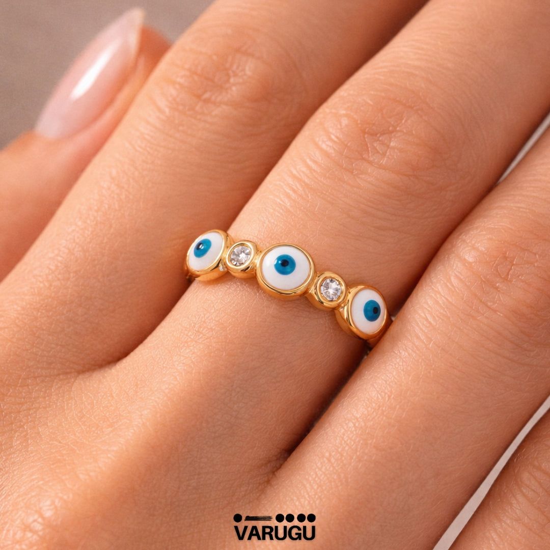 Anillo baño de oro con ojitos y piedras