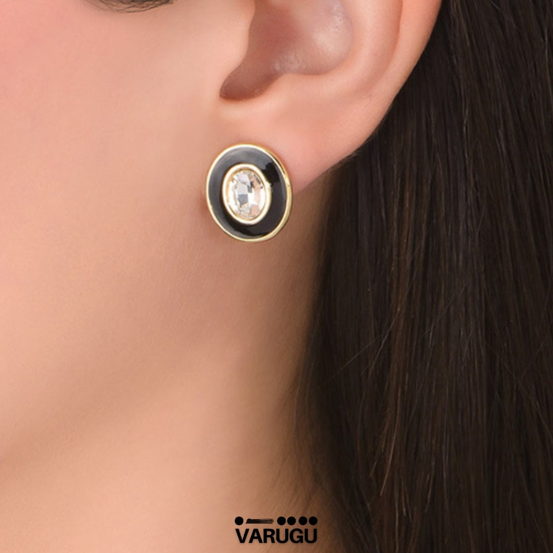 Aretes redondos negros baño de oro y piedra