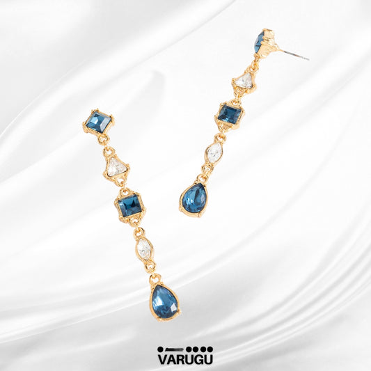 Aretes largos baño de oro con piedras azules y cristales