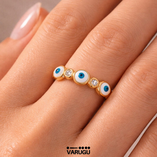 Anillo baño de oro con ojitos y piedras
