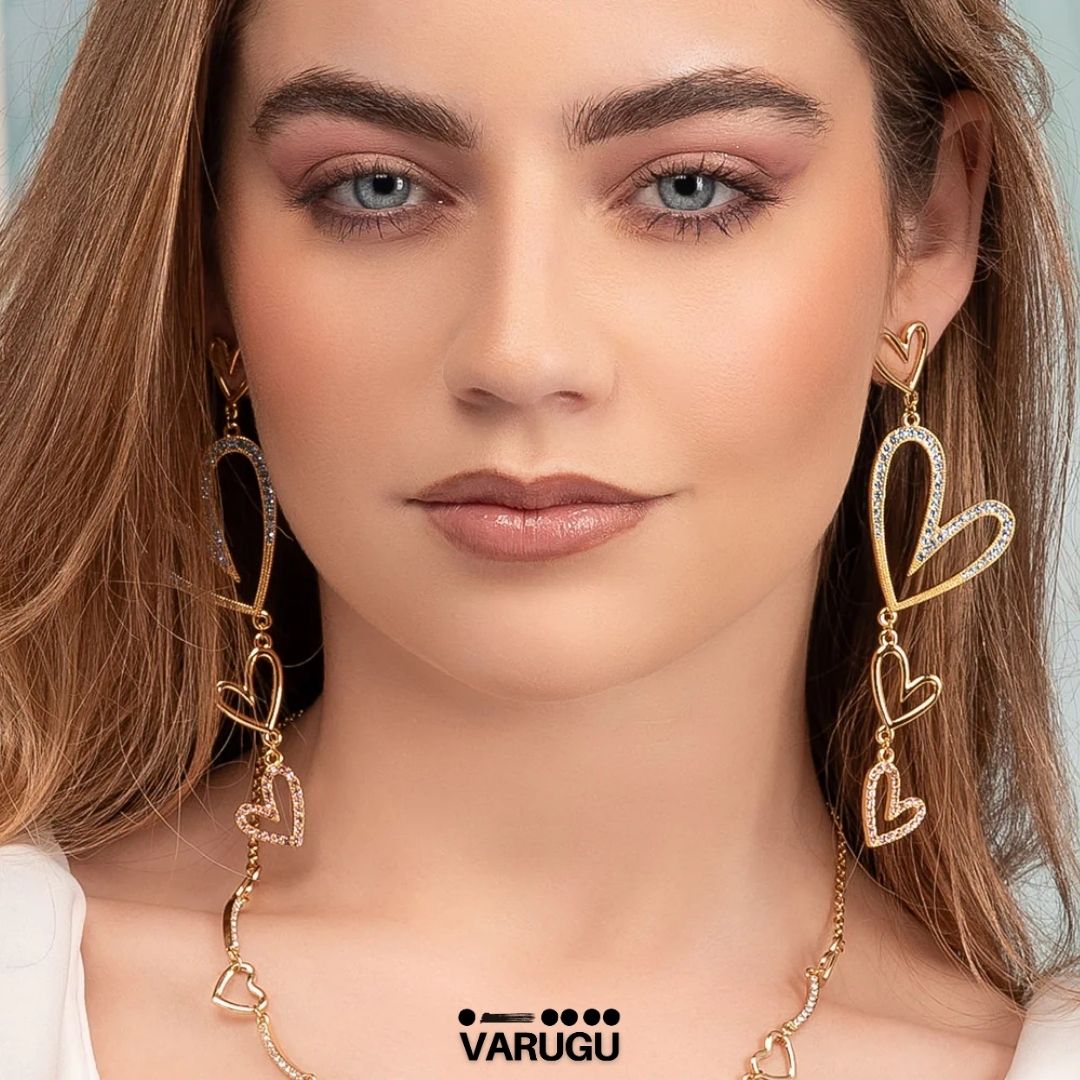 Aretes corazones colgantes en baño de oro