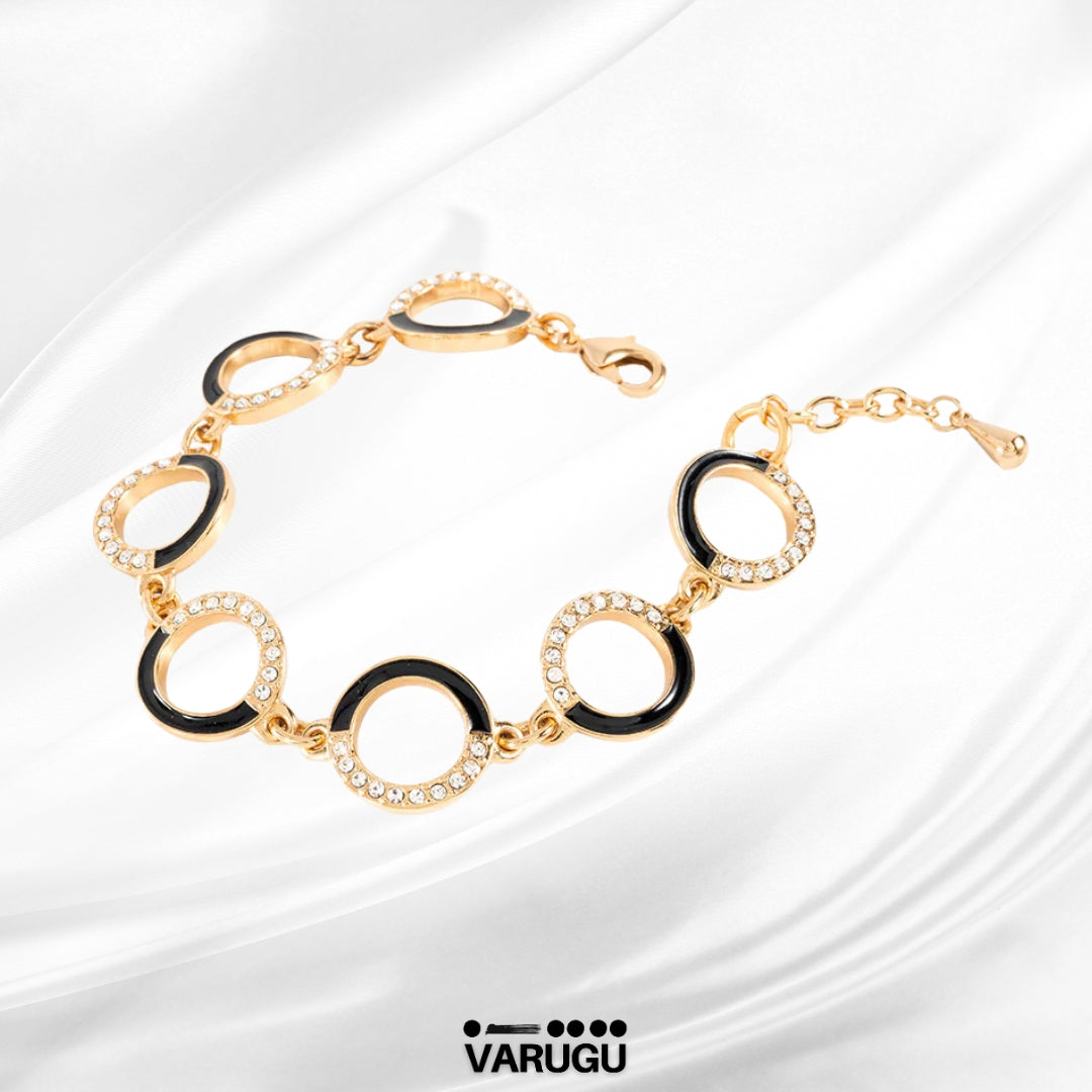Pulsera baño de oro con esmalte negro y piedras