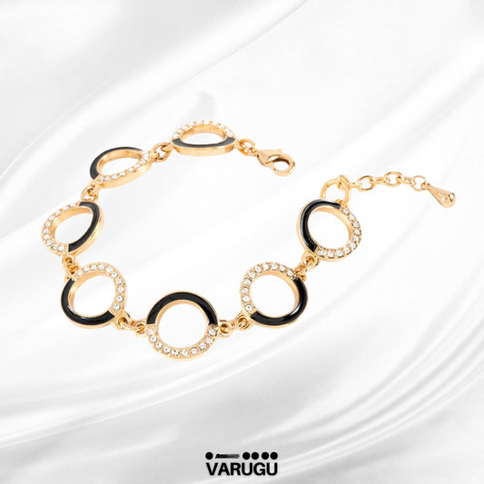 Pulsera baño de oro con esmalte negro y piedras
