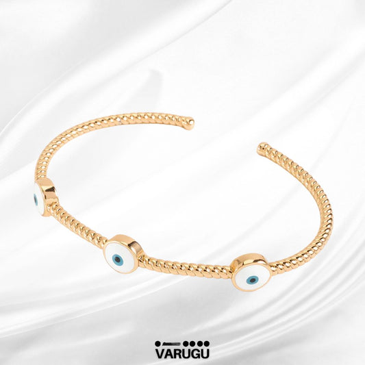 Pulsera con dijes de ojo turco en baño de oro