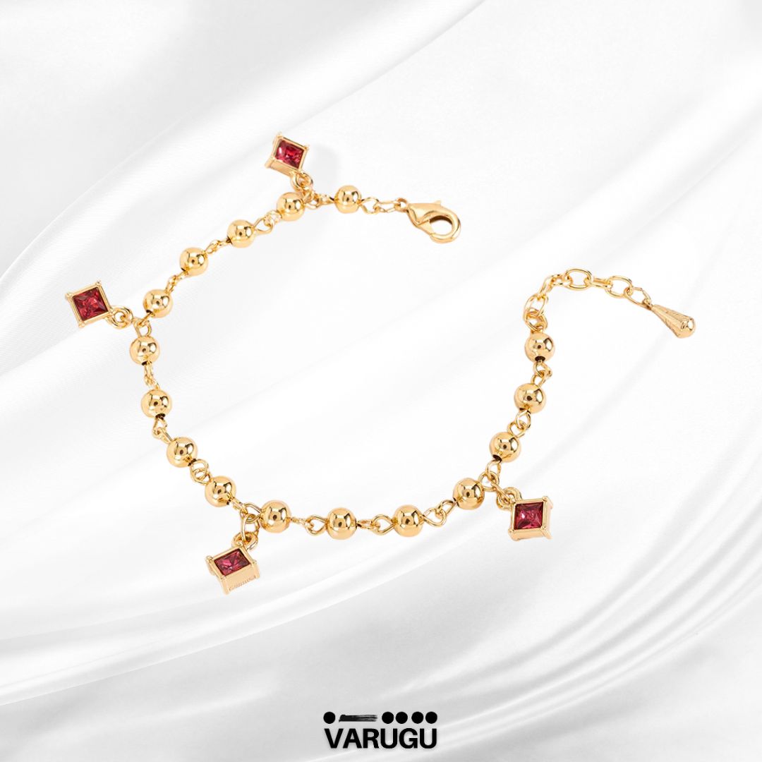 Pulsera con esferas y piedras rosas en baño de oro