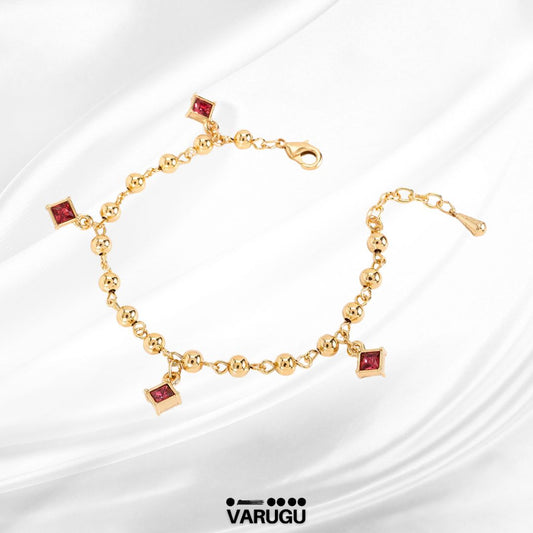 Pulsera con esferas y piedras rosas en baño de oro