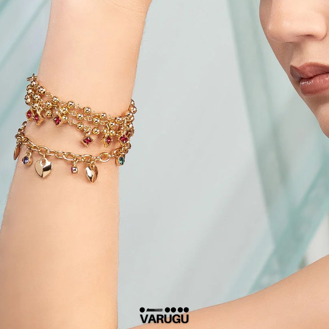 Pulsera con esferas y piedras rosas en baño de oro
